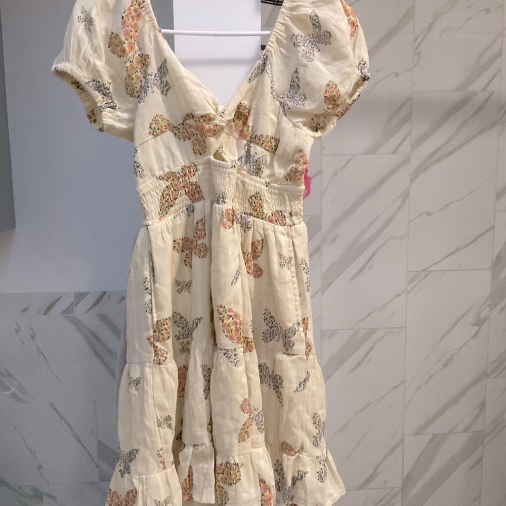 Yellow puffy dress with flowers and butterflies